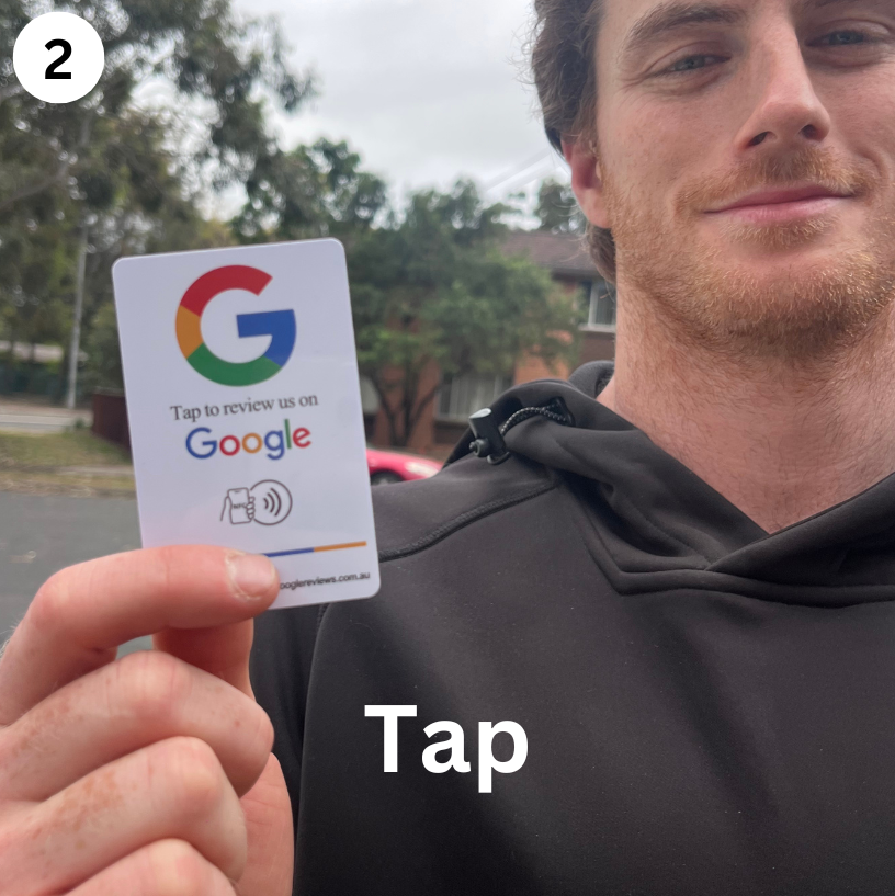 Man showing NFC Google Review Cards